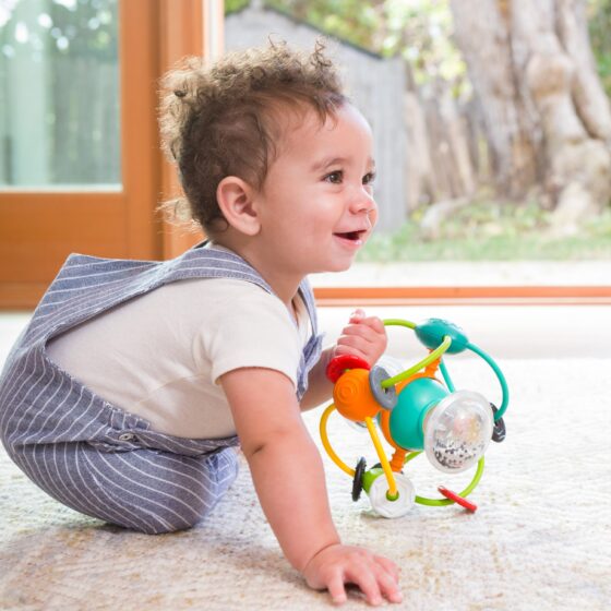 Infantino Activity Ball – Colorful Sensory Baby Ball with Rattle Rings & Rolling Motion - Image 3